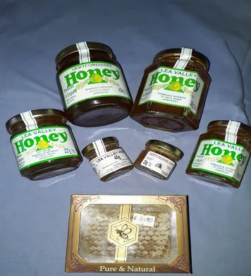 Jars of honey and beeswax polish for sale at Pebadale Apiaries, Waltham Cross